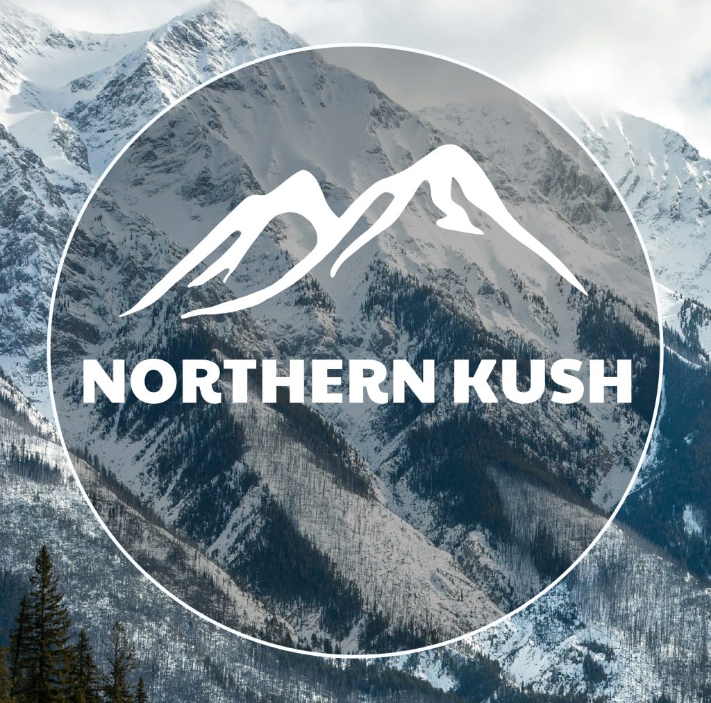 Northern Kush logo with a mountain design overlaying a snowy mountain range, symbolizing premium cannabis delivery from British Columbia.